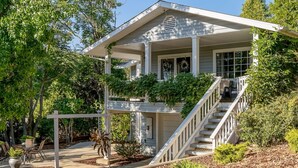 A two-story house with a covered porch, a staircase, and outdoor seating. - Cozy 10 guest, 4 Bedroom, 2 Bath, Pet Friendly, 2-minute walk to downtown Julian (Julian)