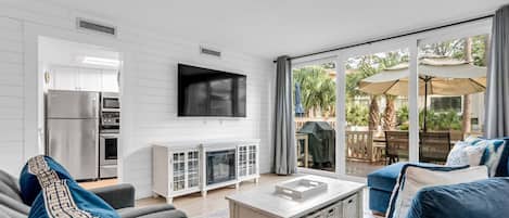 Living Room with Samsung TV, new ship lap walls. Private Deck