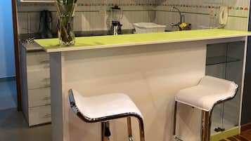 Fridge, microwave, stovetop, cookware/dishes/utensils