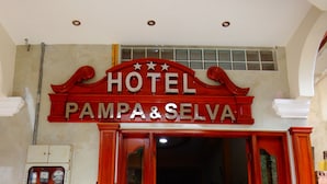 A hotel entrance with a sign reading "HOTEL PAMPA & SELVA". - Pampa & Selva Hotel (Rurrenabaque)