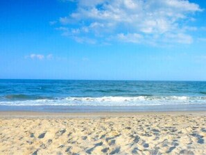 A sandy beach with waves and a clear sky. - Gated Top and Bottom Deck Safe Children  3BR On Bay Canal Great Fishing ! (Jamaica Beach)