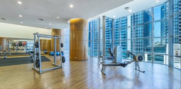 A spacious gym with exercise equipment, large windows, and a modern design. - The Gardens Hotel - St. Giles Mid Valley Kuala Lumpur (Kuala Lumpur)
