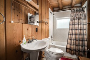 Combined shower/bathtub, hair dryer, towels, toilet paper