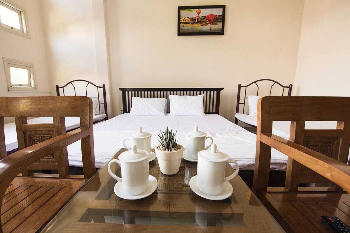 Quadruple Room, City View | Minibar, desk, WiFi (free), bed sheets