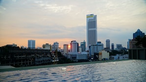 A city skyline with modern buildings and a waterfront.