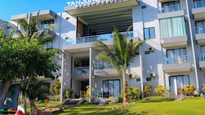 A modern building with a sign reading "Tanjung Kodok Beach Resort". - Tanjung Kodok Beach Resort (Paciran)