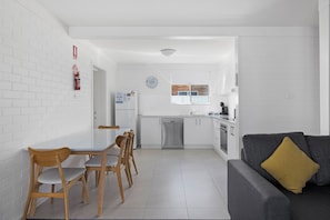 Three Bedroom Apartment | Private kitchen | Full-sized fridge, microwave, oven, stovetop - Seaside Holiday Resort Fingal Bay (Fingal Bay)