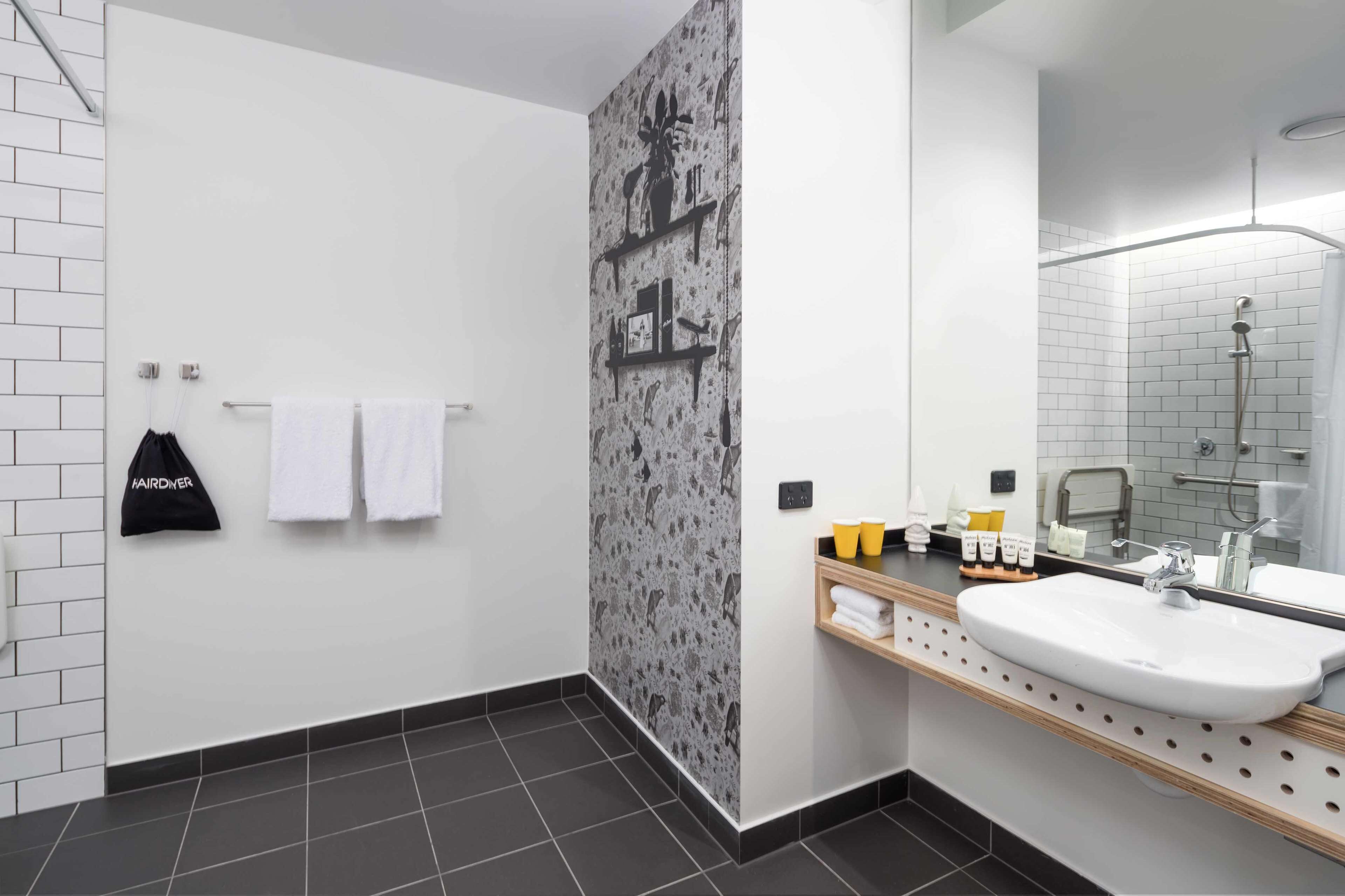 atura city view accessible room | bathroom | shower, designer toiletries, towels