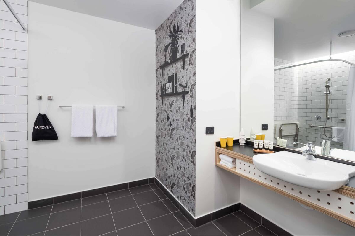 atura city view accessible room | bathroom | shower, designer toiletries, towels