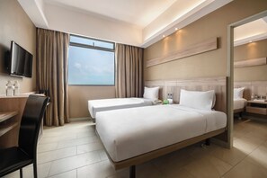 Family Room | Minibar, in-room safe, desk, laptop workspace