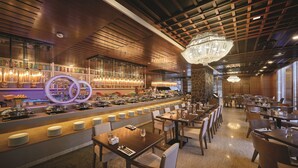 A restaurant with a bar area, wooden ceiling, and a chandelier. -  St.Giles Wembley Penang (George Town)