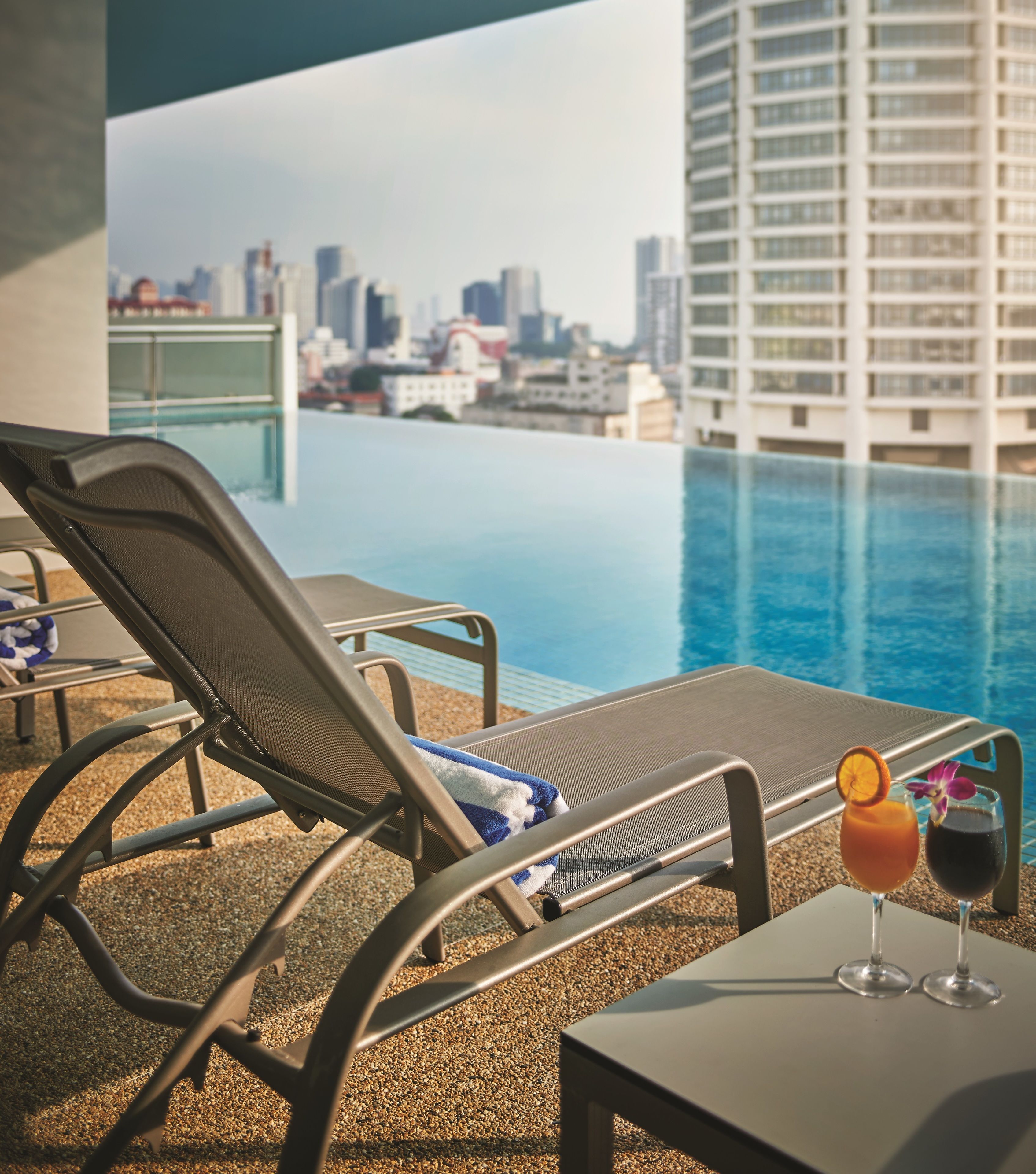 outdoor pool, open 7:00 am to 9:00 pm, pool loungers