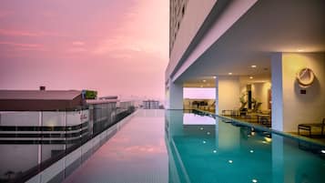 Outdoor pool, open 7:00 AM to 9:00 PM, pool loungers