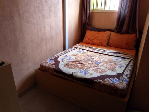 Desk, laptop workspace, blackout curtains, bed sheets