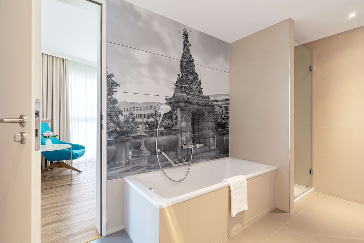 deep-soaking bathtub, rainfall showerhead, eco-friendly toiletries