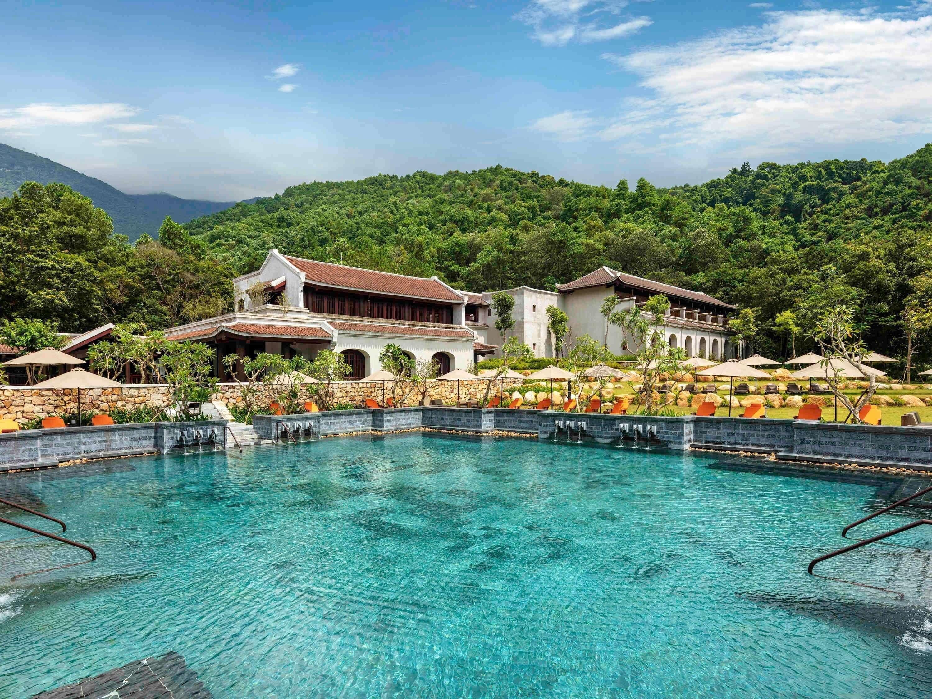 Seasonal outdoor pool, open 6:00 AM to 6:00 PM, pool umbrellas