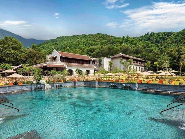 Seasonal outdoor pool, open 6:00 AM to 6:00 PM, pool umbrellas