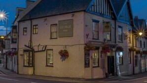 A traditional building with a sign reading "The George Inn." - The George Inn (Barton-upon-Humber)