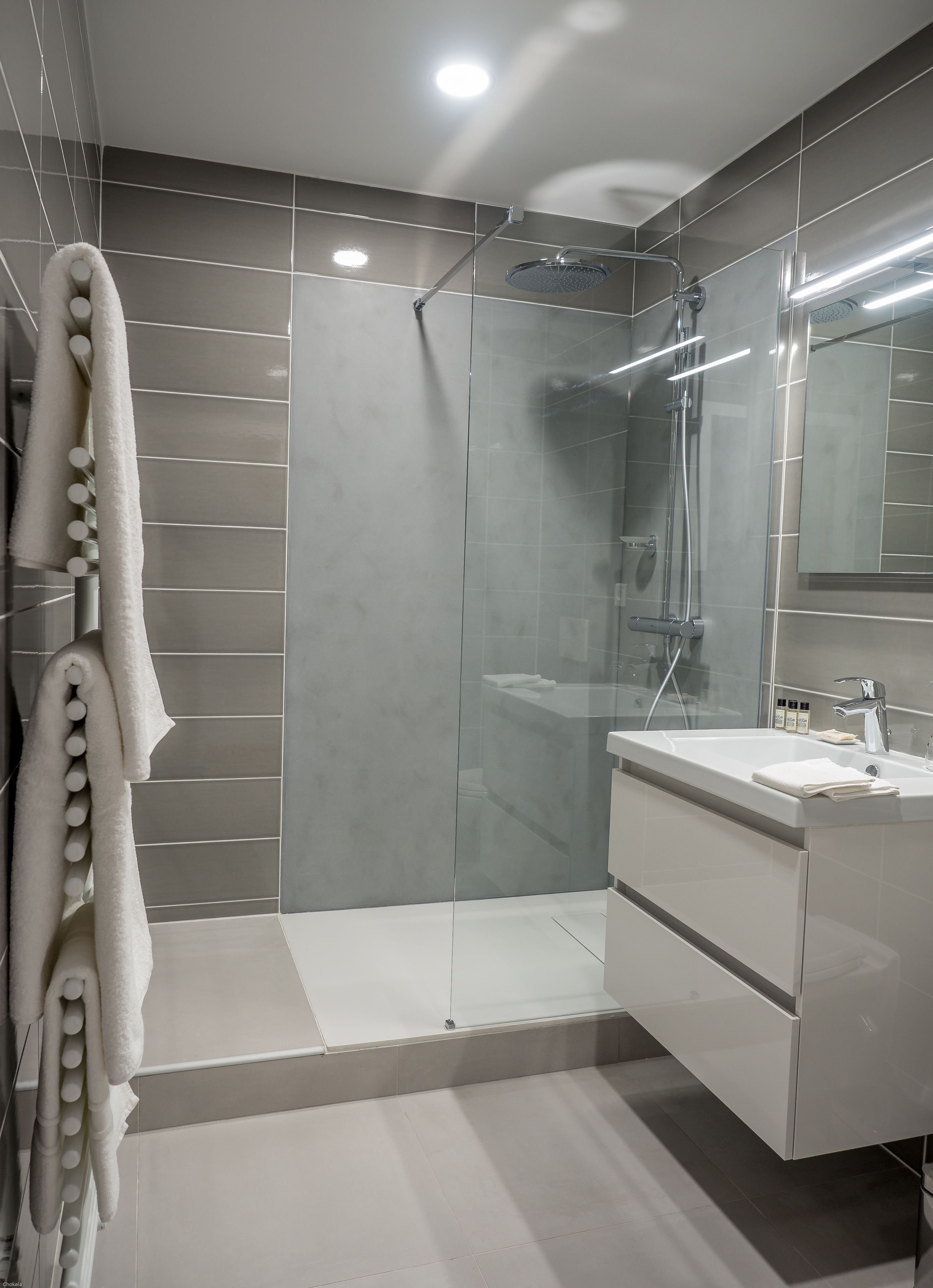 deep-soaking bathtub, rainfall showerhead, free toiletries, hair dryer