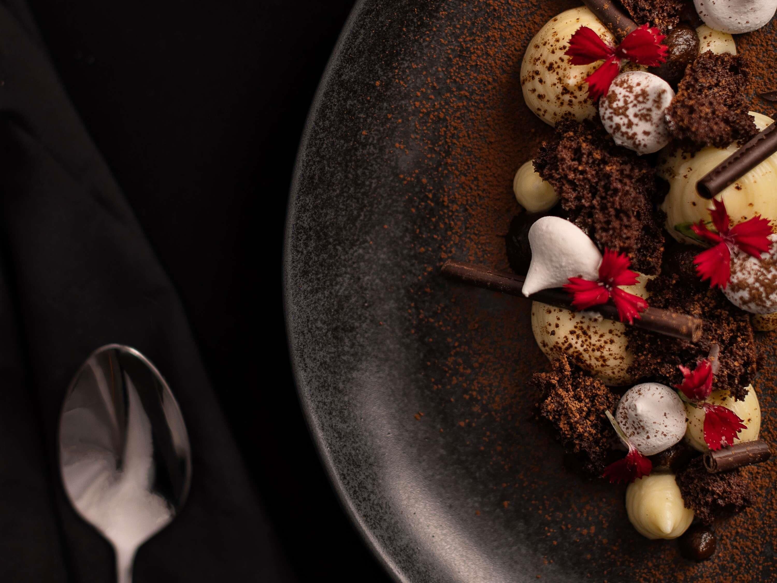 A dessert plate with various sweets and garnishes.