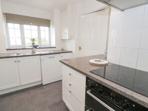Cottage | Private kitchen | Stovetop, dishwasher, highchair, cookware/dishes/utensils