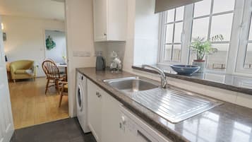 Cottage | Private kitchen | Stovetop, dishwasher, highchair, cookware/dishes/utensils