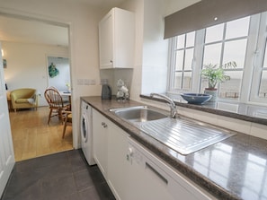 Cottage | Private kitchen | Stovetop, dishwasher, highchair, cookware/dishes/utensils
