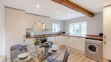 Cottage | Private kitchen | Dishwasher, highchair, cookware/dishes/utensils