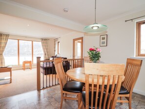 Enjoy meals in this inviting dining area with a round table and comfortable seating for six.