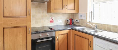 Cottage | Private kitchen | Fridge, oven, stovetop, highchair