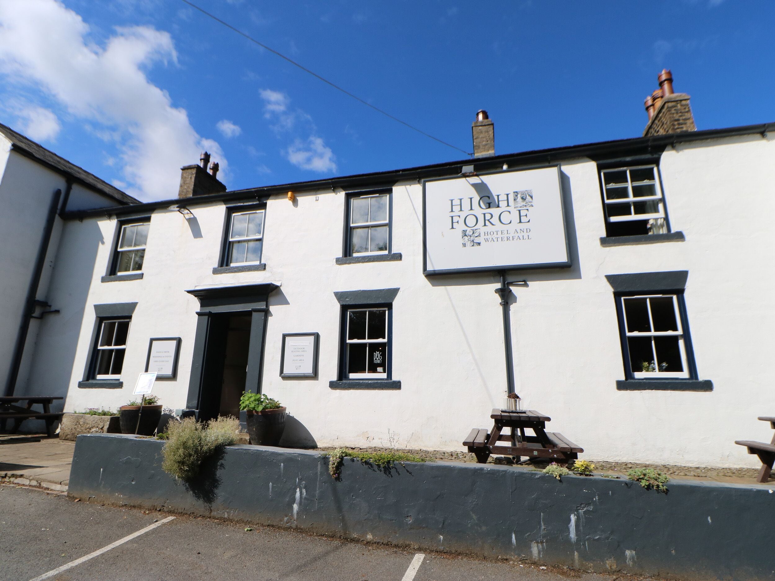 A building with a sign reading 'High Force Hotel and Waterfall'.
