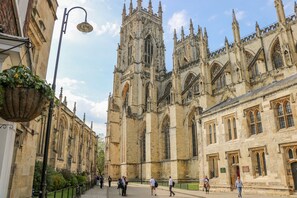 A historic cathedral with Gothic architecture, including pointed arches and a tall central tower. - 1 Pines Farm Cottages (Tadcaster)
