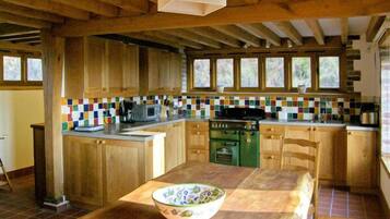 Cottage | Private kitchen | Stovetop, dishwasher, highchair, cookware/dishes/utensils