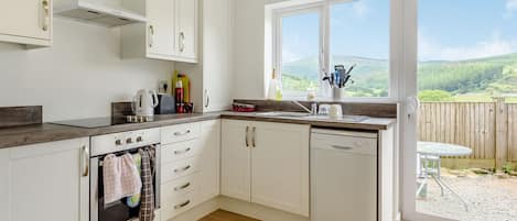 Cottage | Private kitchen | Stovetop, dishwasher, highchair, cookware/dishes/utensils