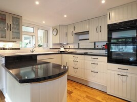 Cottage | Private kitchen | Stovetop, dishwasher, highchair, cookware/dishes/utensils