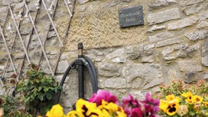 A stone wall with a sign reading "Brookside Barn." - Brookside Barn (Hope Valley)
