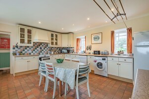 Cottage | Private kitchen | Fridge, dishwasher, highchair, cookware/dishes/utensils