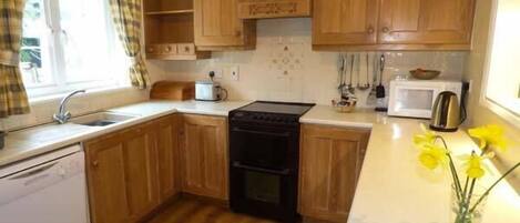 Cottage | Private kitchen | Microwave, stovetop, dishwasher, highchair