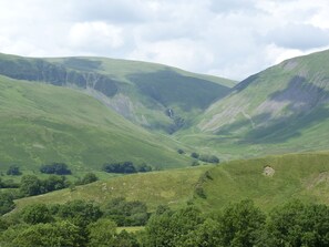 A valley with rolling hills and a waterfall. - Knott Lodge (Sedbergh)