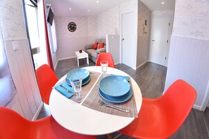 Apartment, 1 Bedroom | Living room | Flat-screen TV