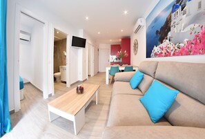 Deluxe Apartment, 2 Bedrooms | Living room | Flat-screen TV