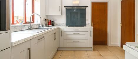 Cottage | Private kitchen | Stovetop, dishwasher, highchair, cookware/dishes/utensils