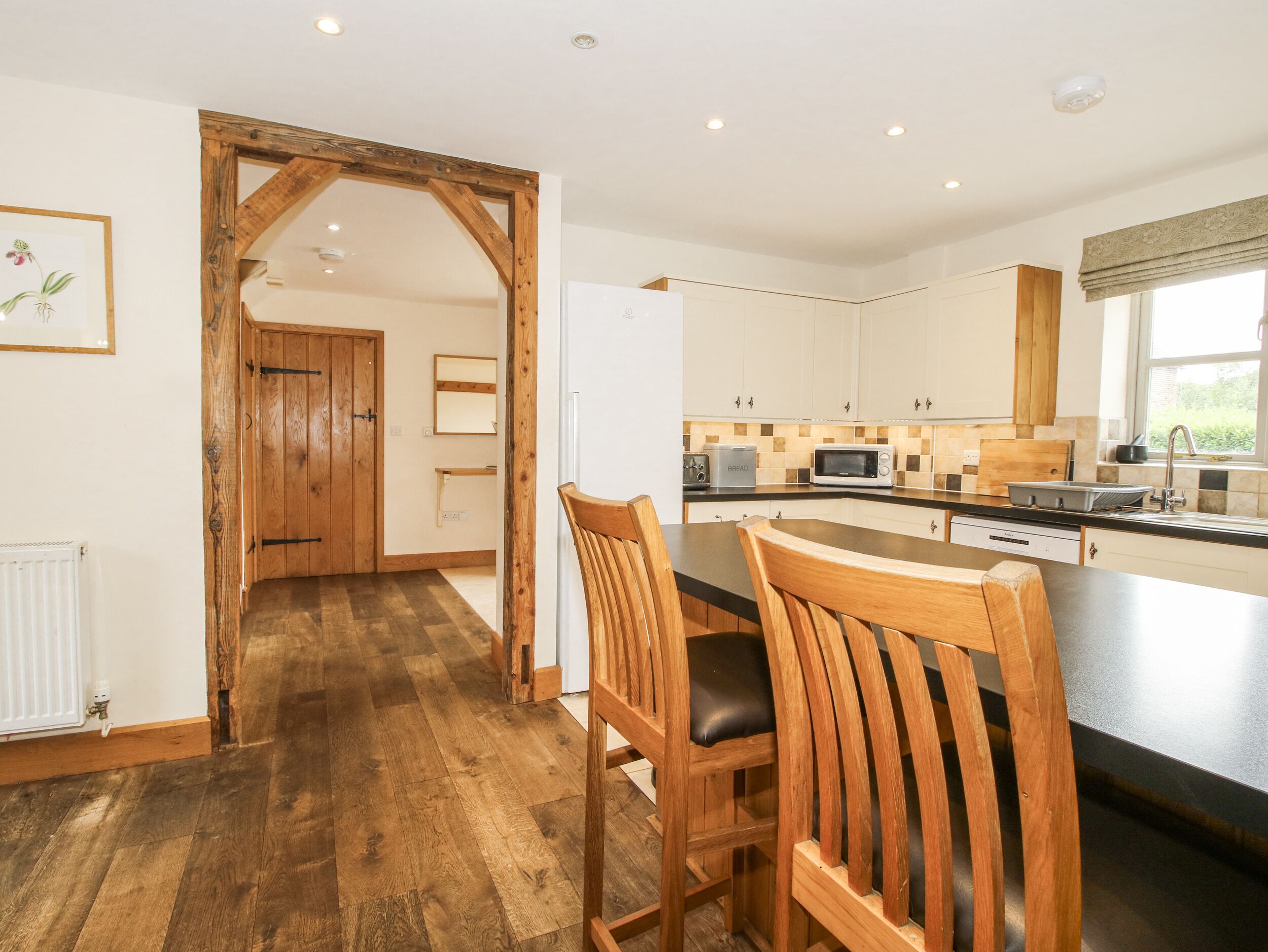 Fridge, dishwasher, high chair, cookware/dishes/utensils