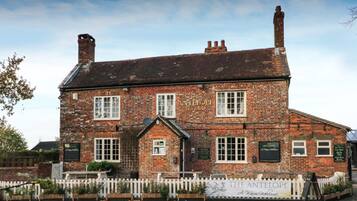 A traditional brick building with a sign reading "The Antelope Free House."