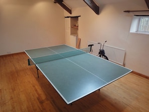 Enjoy a game of ping pong and take in the view from the window in this room.