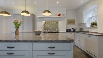 Dishwasher, coffee/tea maker, high chair, cookware/dishes/utensils