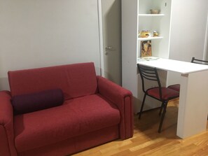 Standard Apartment | Living area | 32-inch flat-screen TV with cable channels, TV