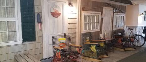 A seafood restaurant with wooden walls and a sign reading "Fresh Lobster".