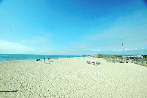 On the beach, sun-loungers, beach umbrellas, beach towels