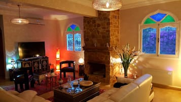 TV, fireplace, books, stereo